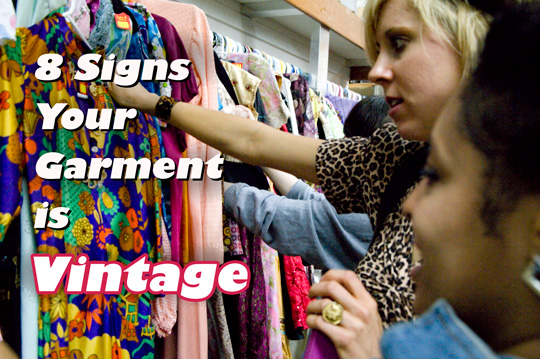 dating-clothing-vintage girls looking at racks of vintage clothing